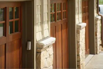 Three-car Craftsman-style garage doors with windows