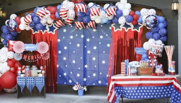 Red white and blue decorations arranged around a garage party area