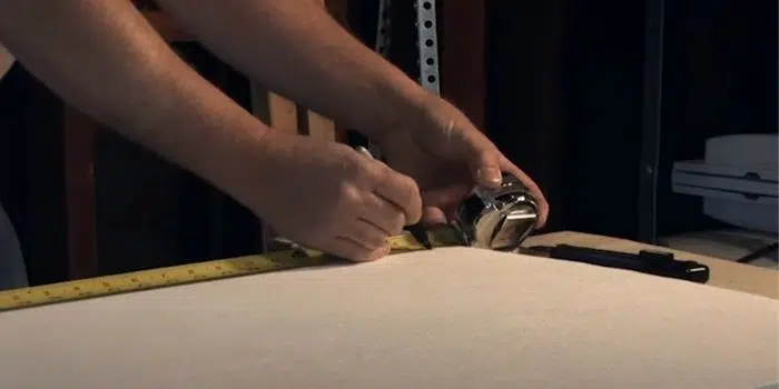 Cutting garage door insulation against a straightedge