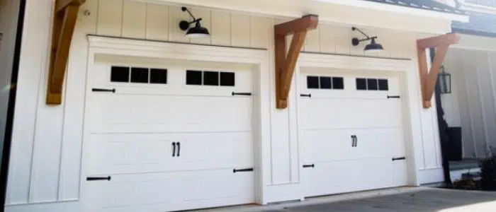 White barn-style garage doors with windows