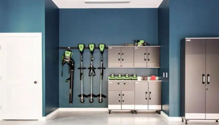 Blue painted garage wall with coordinated storage cabinets