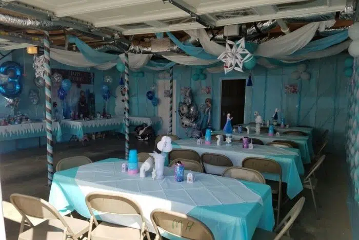 Children's winter themed birthday party arranged in a garage