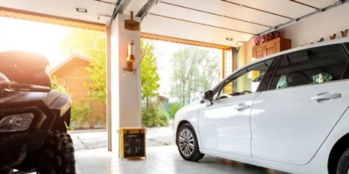 Garage with a large exterior door open to daylight for a hummingbird to exit