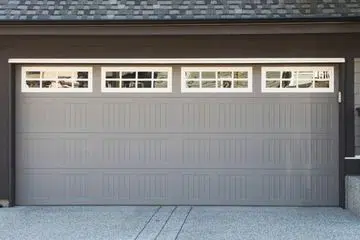 Gray traditional garage door with upper windows