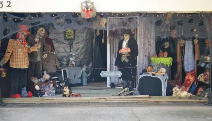 Halloween scene with gray drapes covering garage walls