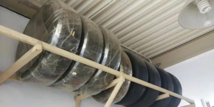 Tires organized indoors on a clean garage storage surface