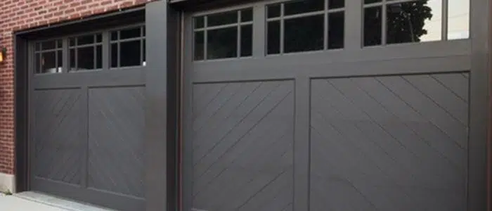Black modern garage door with asymmetrical windows