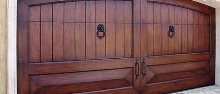 Large wood barn-style garage door with windows