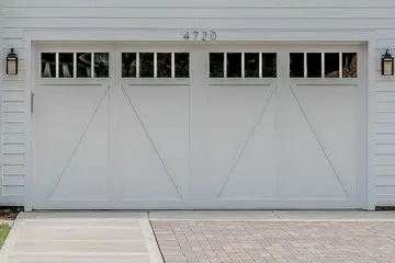 White Colonial-style garage door with windows