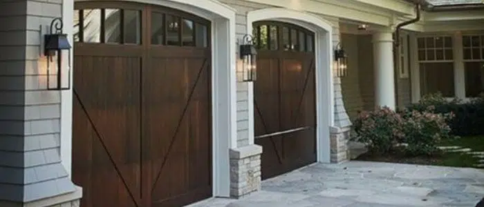 Single-car wood-look garage door with windows